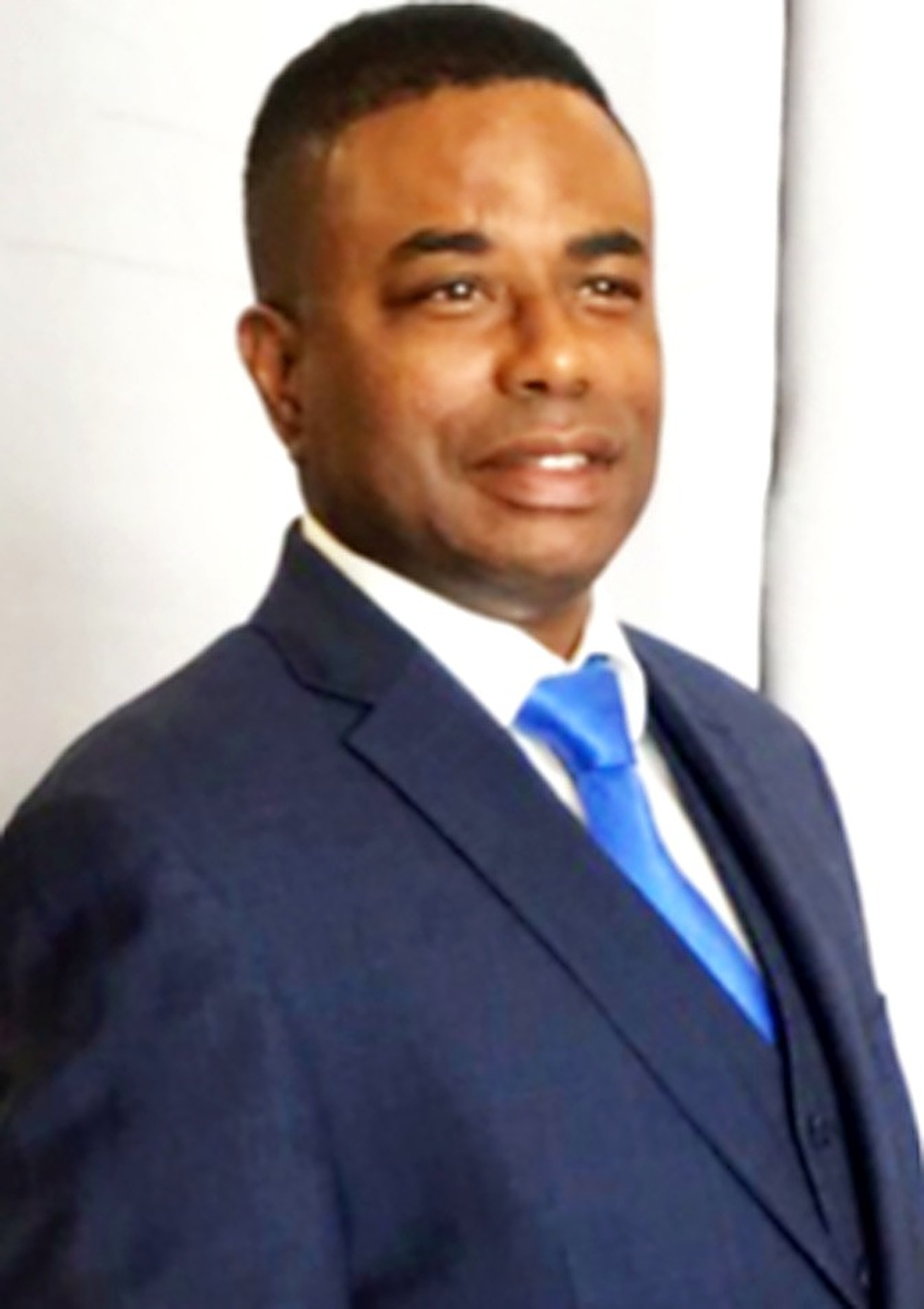 Portrait of Jarrett K. Smith in a navy suit