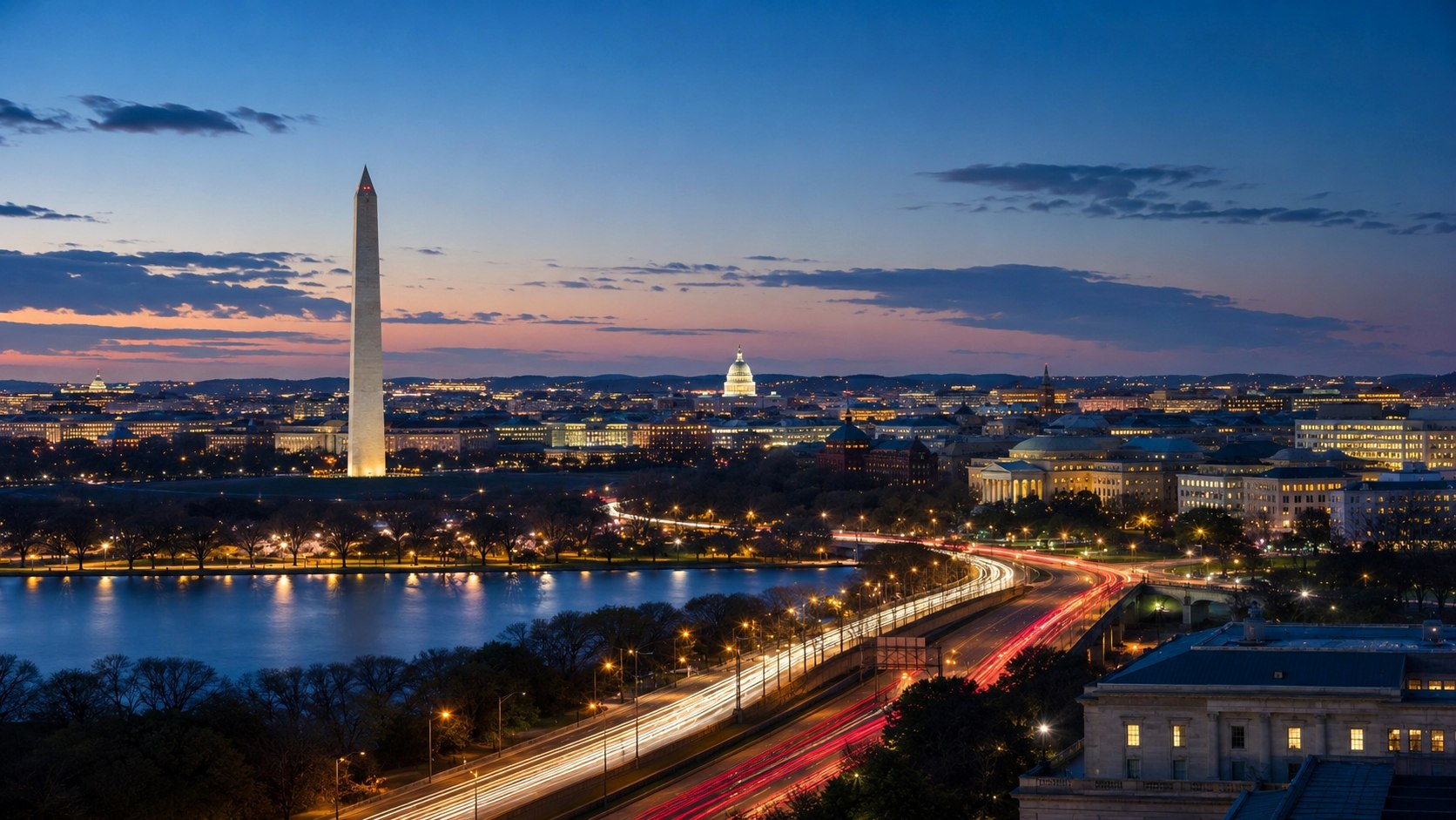 Washington, D.C. at dusk — the Washington Monument, U.S. Capitol dome, and federal skyline above the Tidal Basin with light-trail traffic